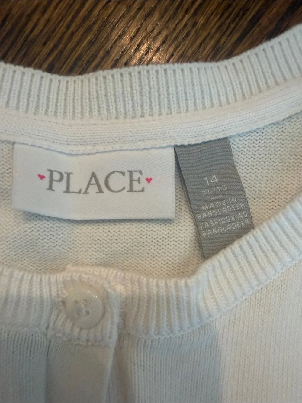 Place button front by